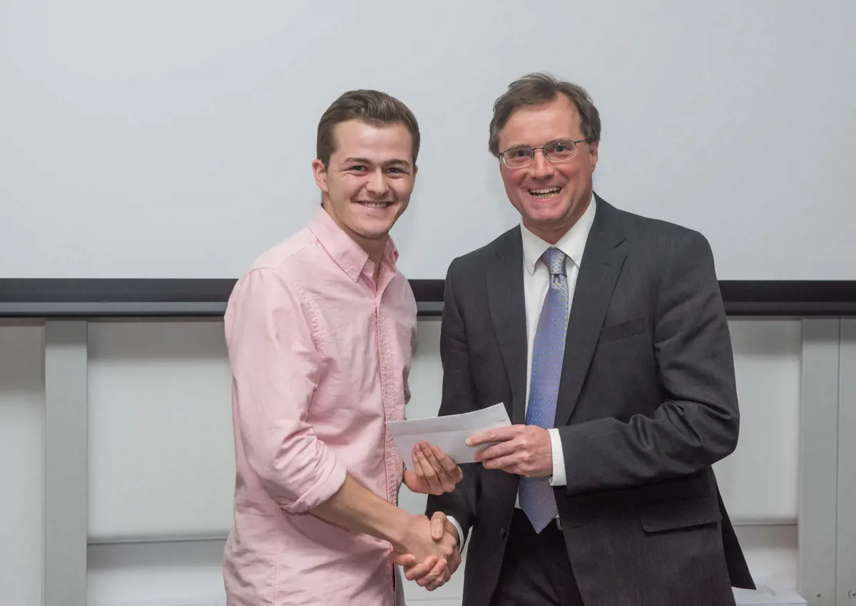 4th year student receiving their project poster prize at the lubbock lecture