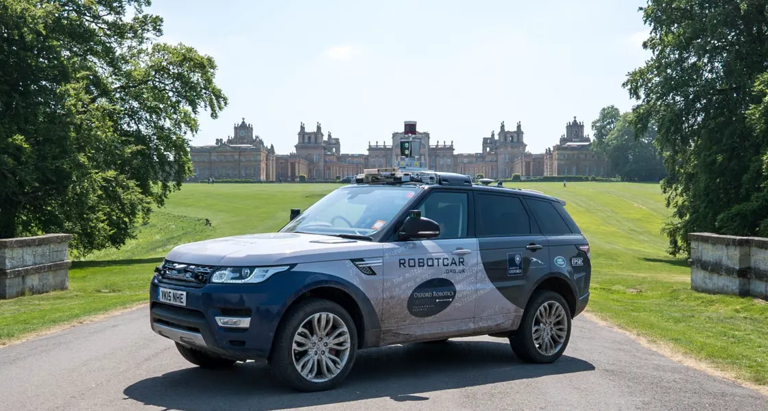 Oxford Robotics Institute vehicle on drive with Blenheim Palace in background