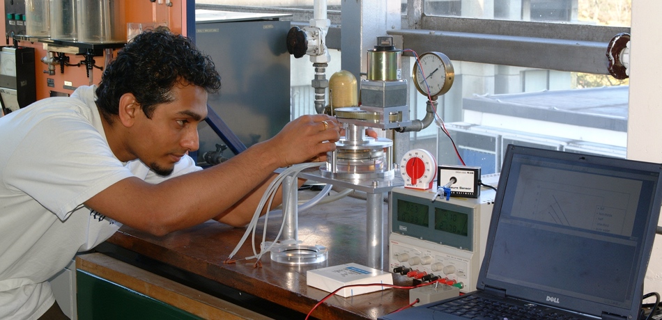 Student working in lab with equipment