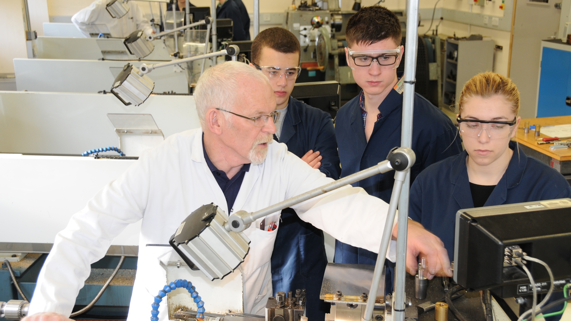 Students watching demonstrator in lab