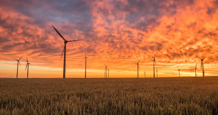 Wind turbines against the sunset