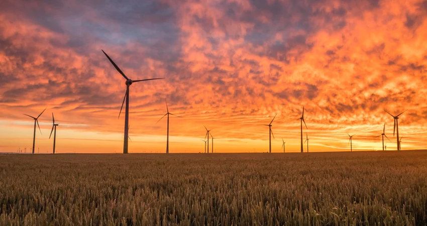 Wind turbines against the sunset