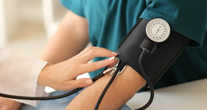 Patient's blood pressure being monitored