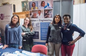 Female DPhil students at Women in Engineering network stall at a women in STEM event