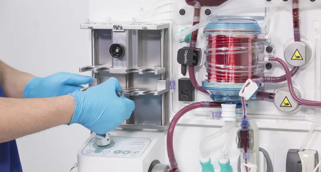 Clinician working on Organox metra machine which enables storage and functional assessment of donor organs prior to transplantation