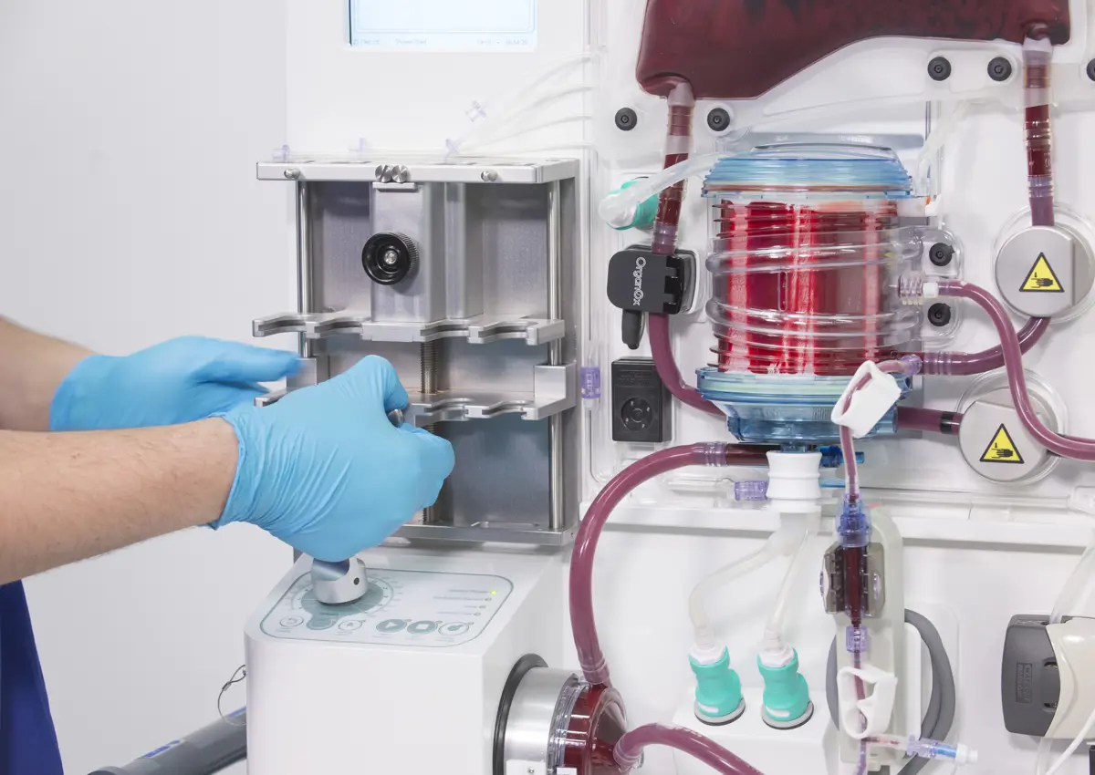 Clinician working on Organox metra machine which enables storage and functional assessment of donor organs prior to transplantation