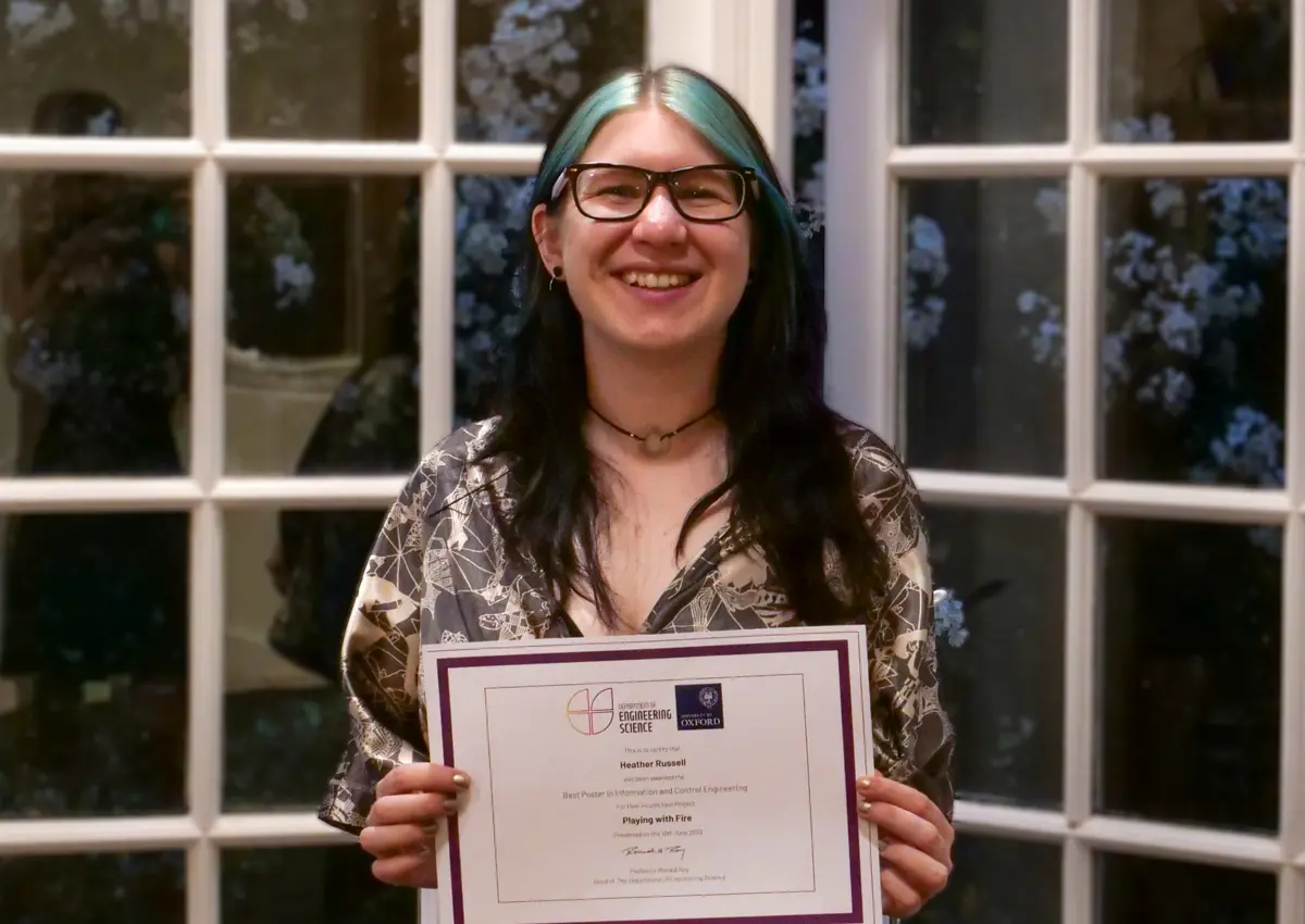 4th year student, Heather Russell (Information & Control winner) holding her certificate.