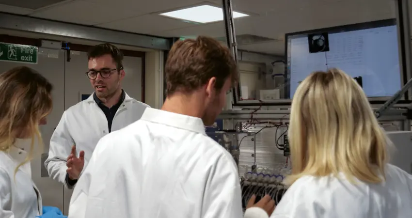 Professor Harrison Steel in his lab, working with students on their research.