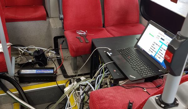 Laptop inside bus attached to various sensors used to measure NOx emissions on key routes