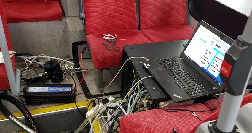 Laptop inside bus attached to various sensors used to measure NOx emissions on key routes