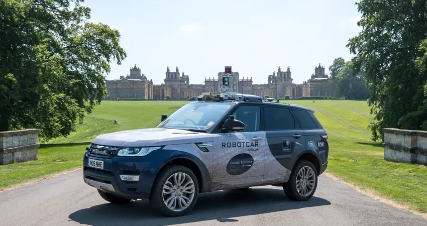 Oxford Robotics Institute vehicle on drive with Blenheim Palace in background