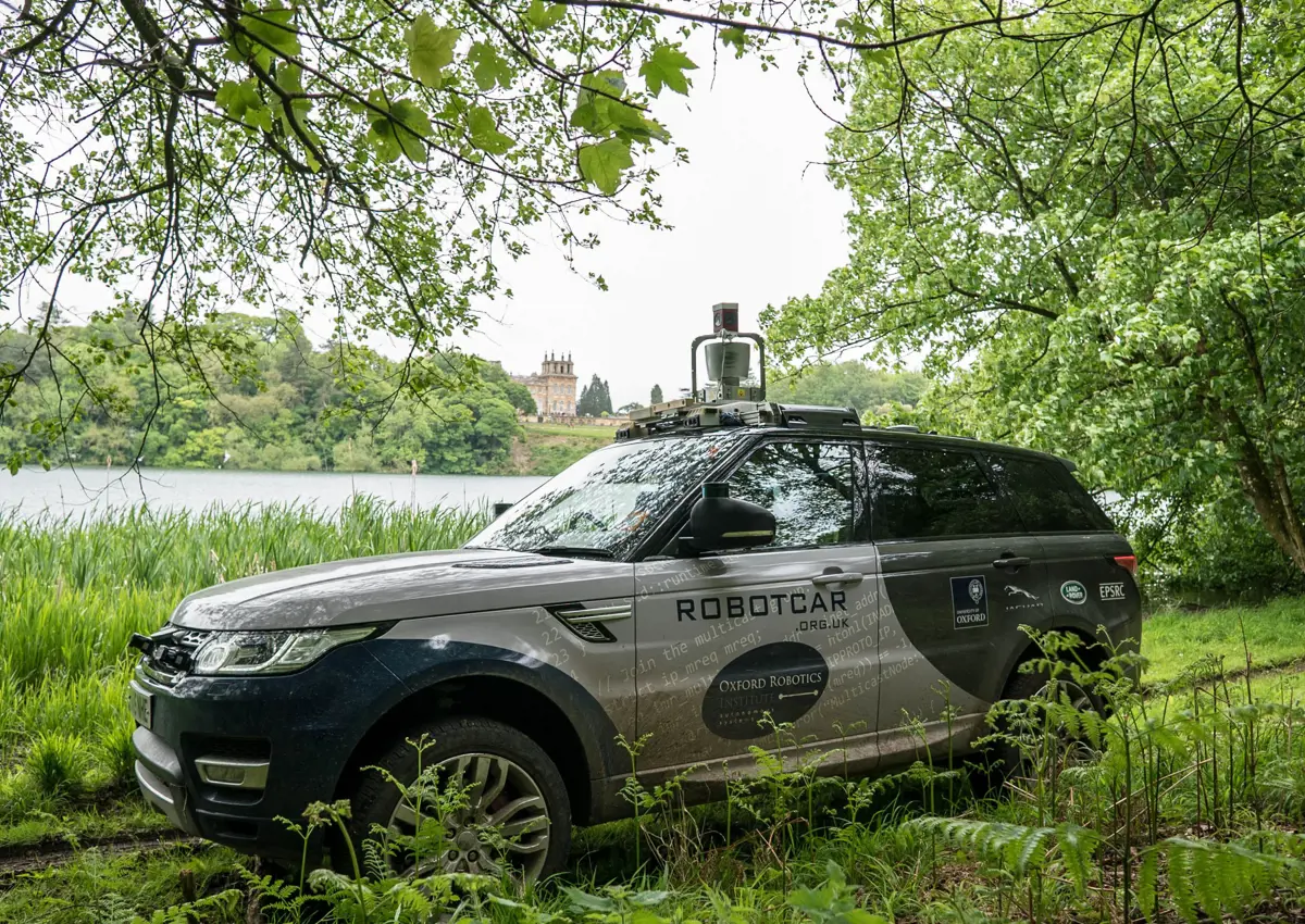 Oxford Robotics Institute vehicle offroad at Blenheim Palace with lake in background