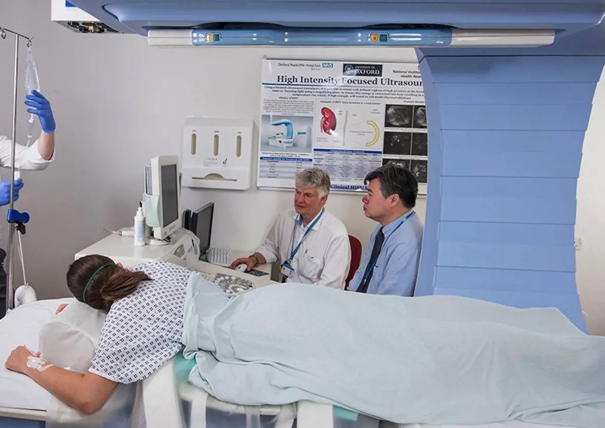 Trials of a new technique using ultrasound to remotely trigger and enhance cancer drug delivery to the tumor. Image shows medical professionals with a patient.