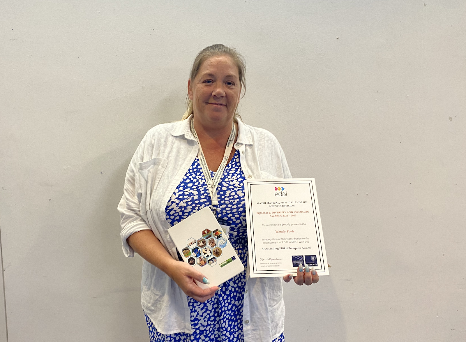 Wendy Poole holding her MPLS ED&I Award for the staff category.
