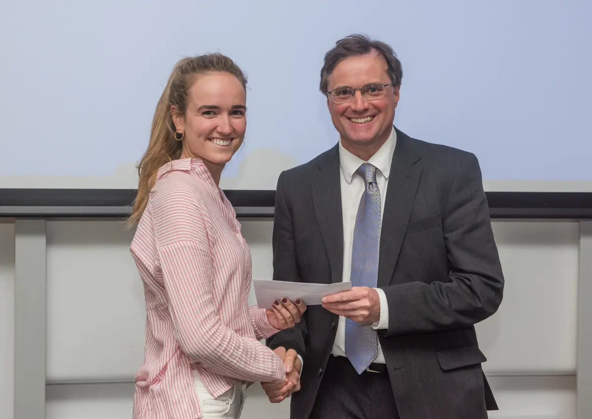 4th year student receiving her project poster prize at the lubbock lecture