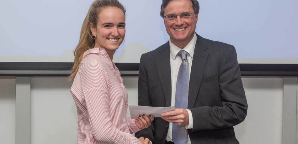 4th year student receiving her project poster prize at the lubbock lecture