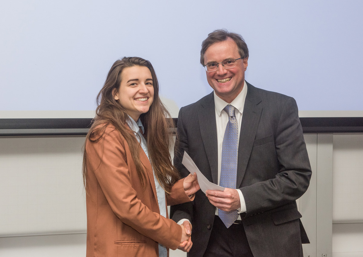 4th year student receiving her project poster prize at the lubbock lecture