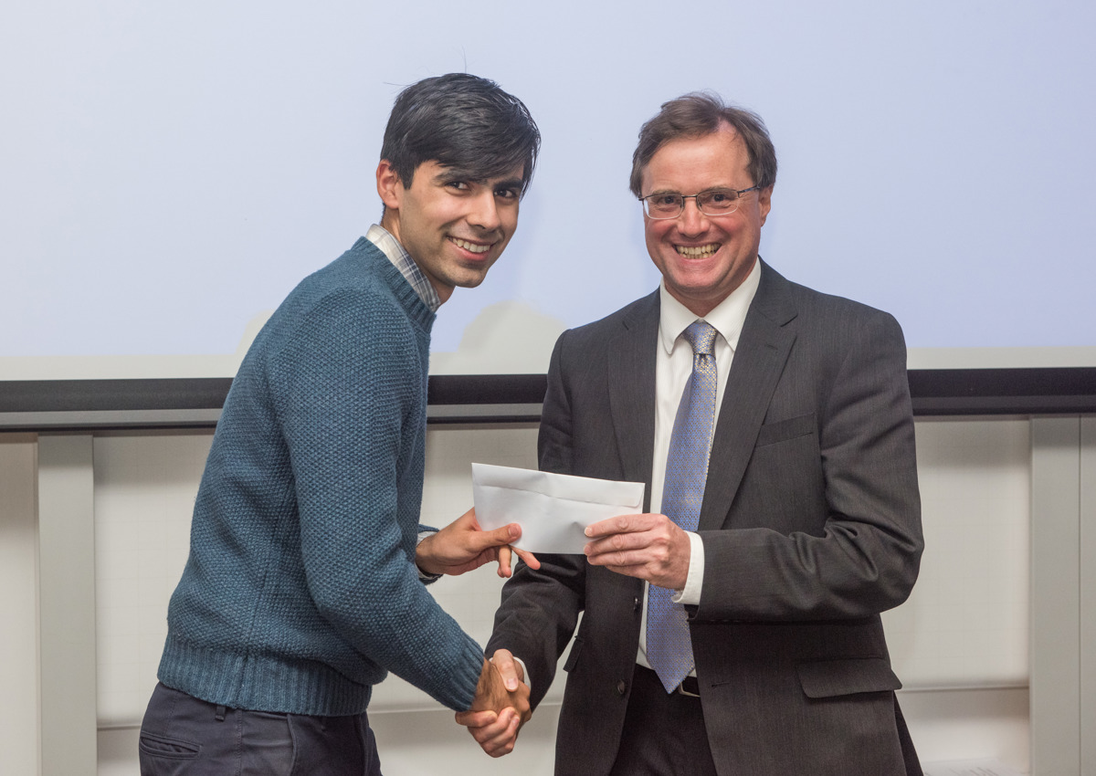 4th year student receiving his project poster prize at the lubbock lecture