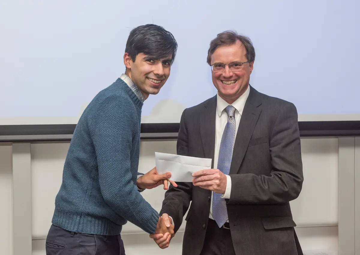 4th year student receiving his project poster prize at the lubbock lecture