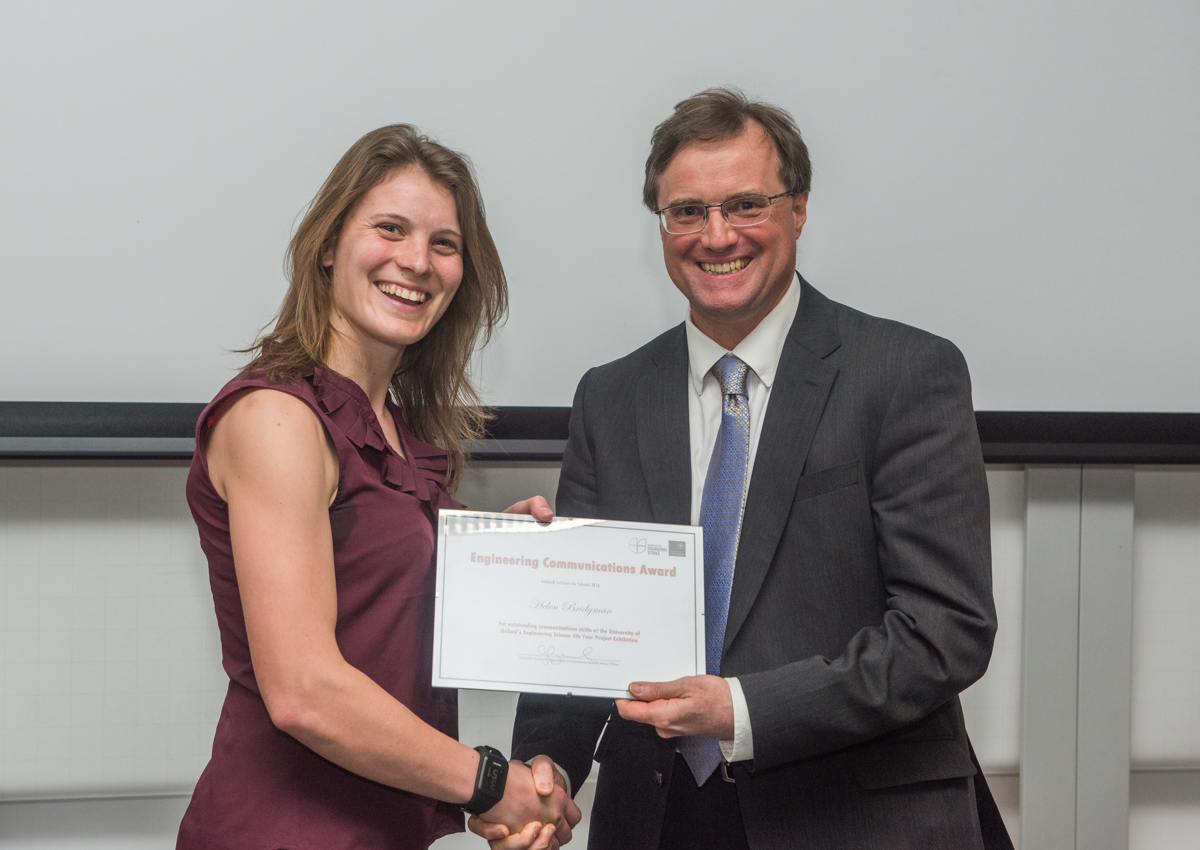 4th year student receiving her project poster prize at the lubbock lecture