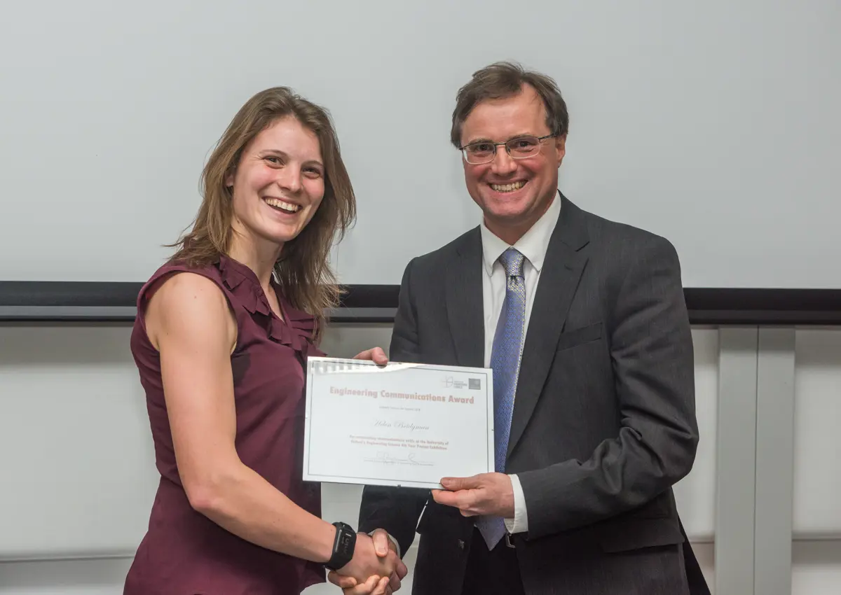4th year student receiving her project poster prize at the lubbock lecture