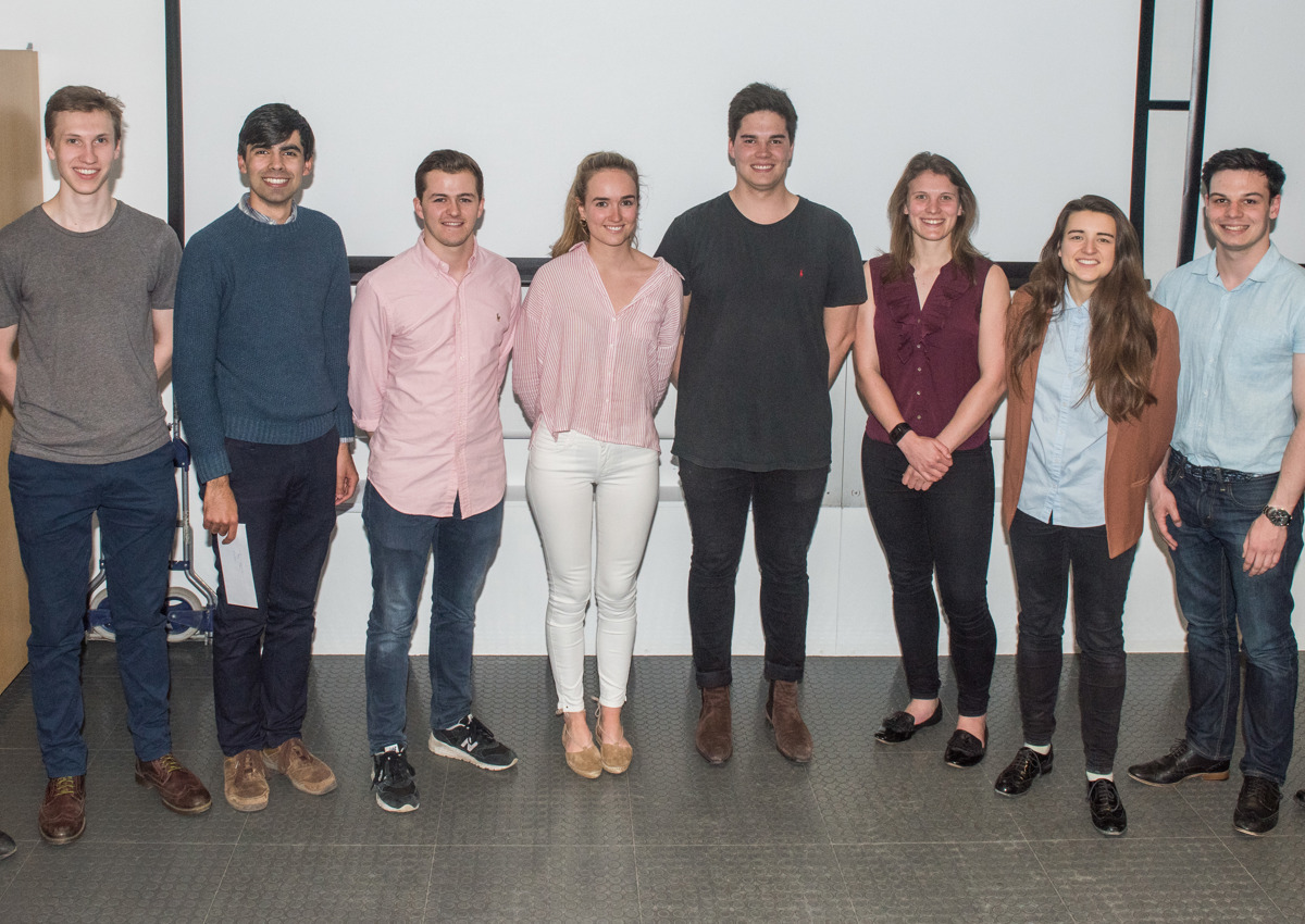 4th year students line up to receive their project poster prize