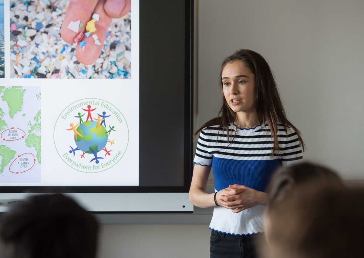 Student giving presentation on environment