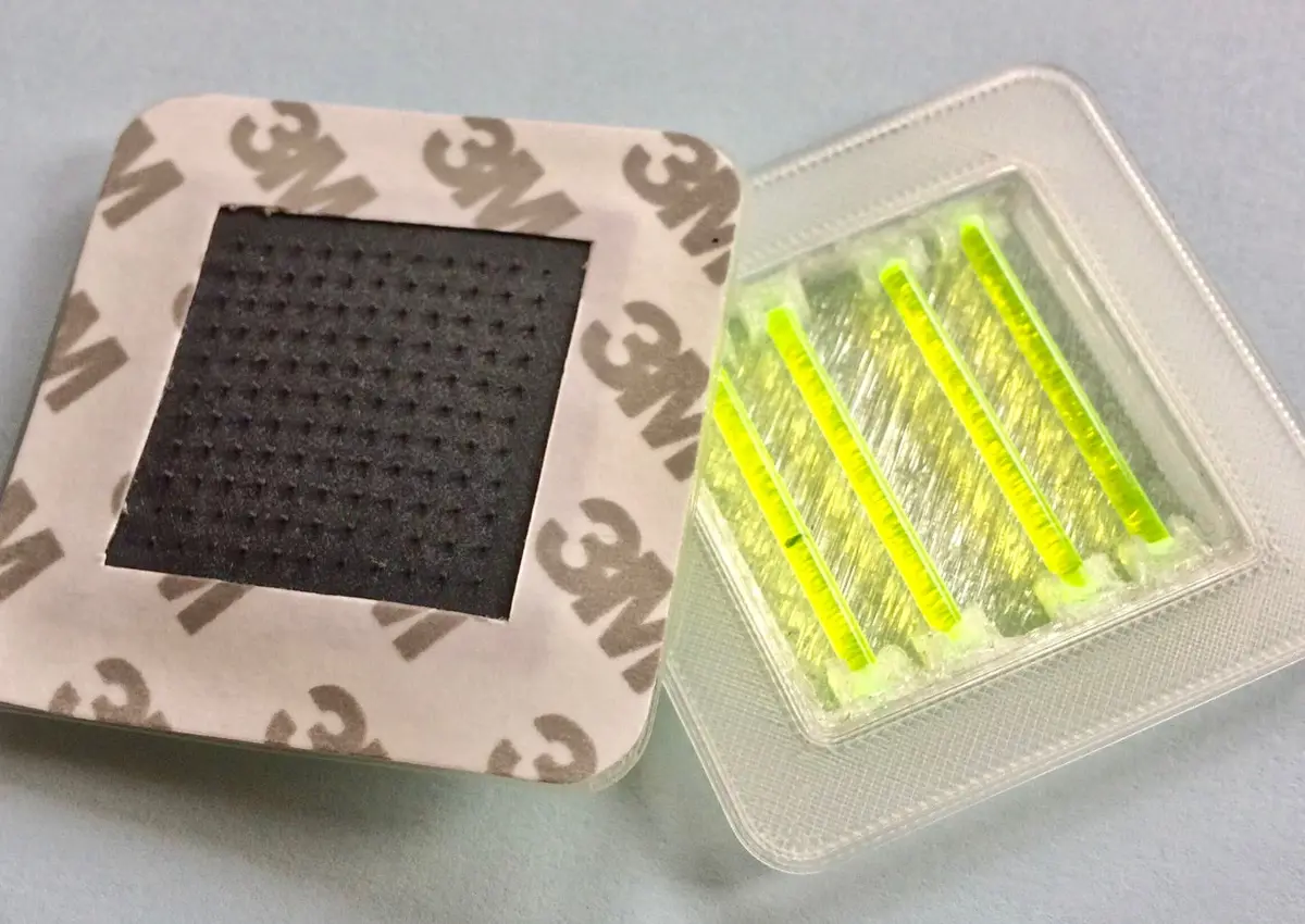 Snapvaccine prototype showing a simple mechanism used in glow sticks, snap mechanism and contained mixing system, with microneedles to deliver the vaccine via a stick-on patch