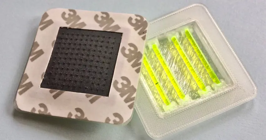 Snapvaccine prototype showing a simple mechanism used in glow sticks, snap mechanism and contained mixing system, with microneedles to deliver the vaccine via a stick-on patch