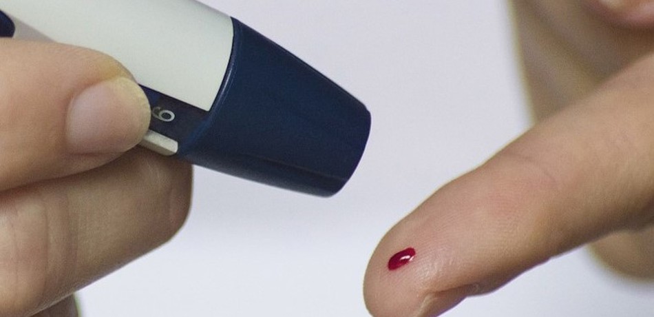 Stock image of finger prick blood test