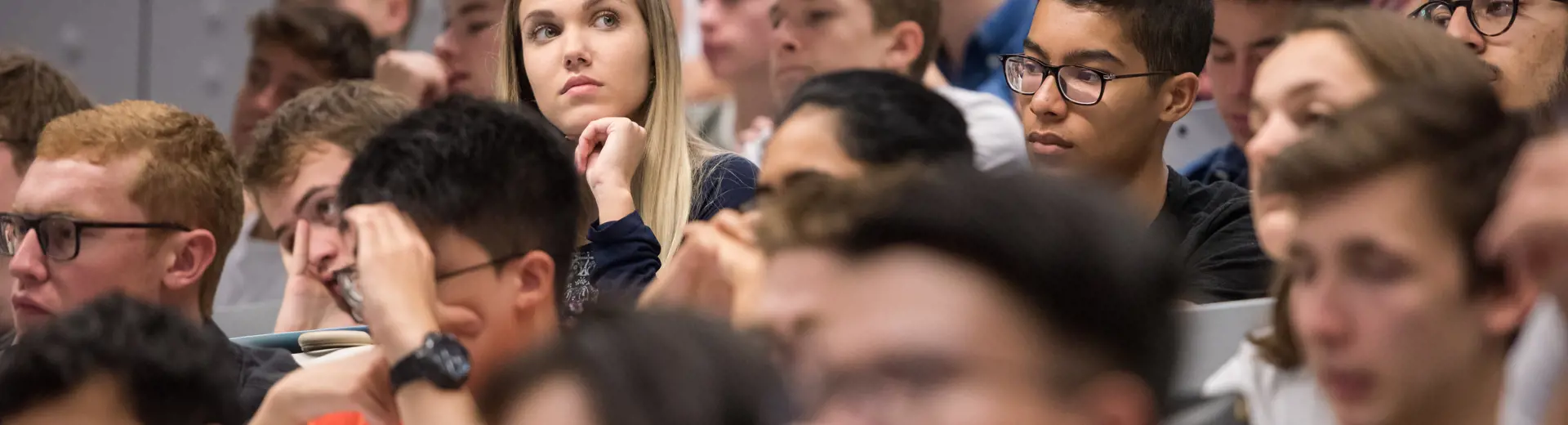 Full lecture theatre of students