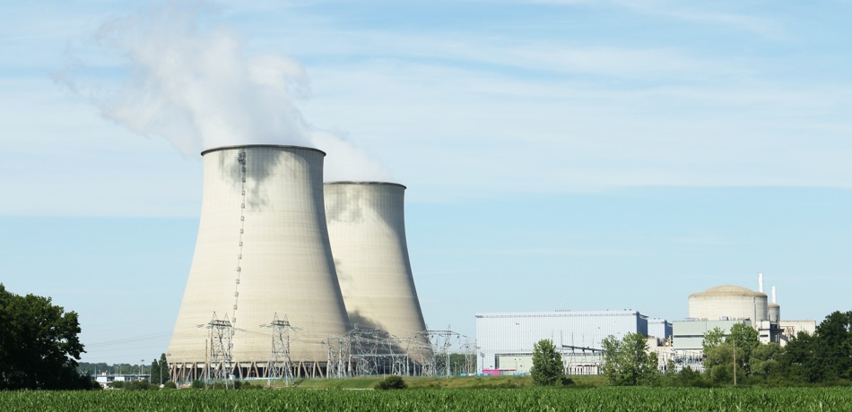 Big cooling towers in a factory in the countryside