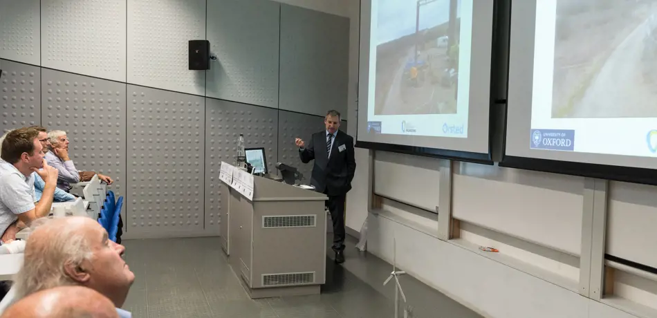 Alumni in lecture theatre listening to talk by Professor Byron Byrne