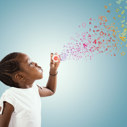 A child blowing bubbles, but instead of bubbles it is colourful letters of the alphabet