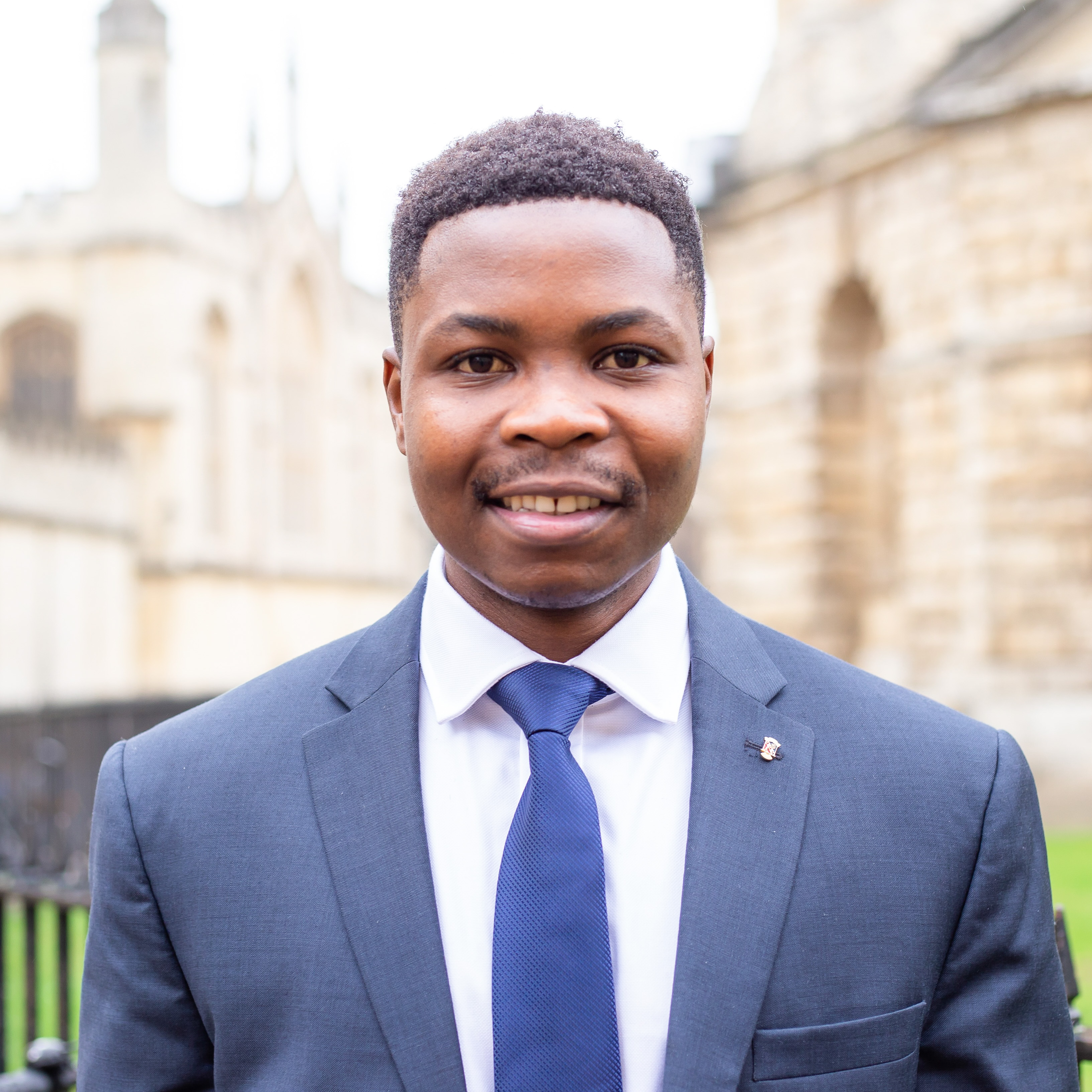 Young man smiling in suit