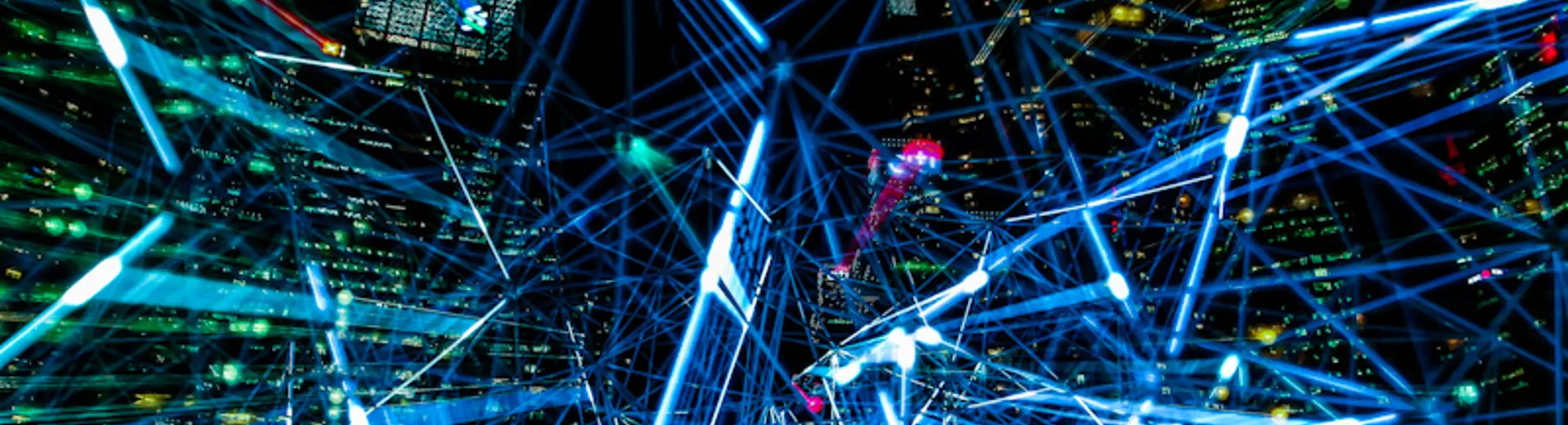 Network of lasers in front of a city scape