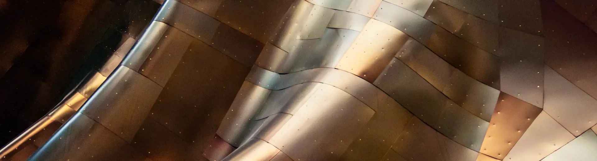Abstract architectural design of sheet metal shaped in waves