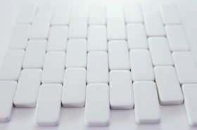 White tiles in a vertical brick pattern