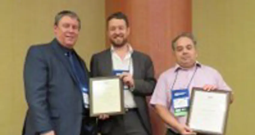 Three people displaying their certificates