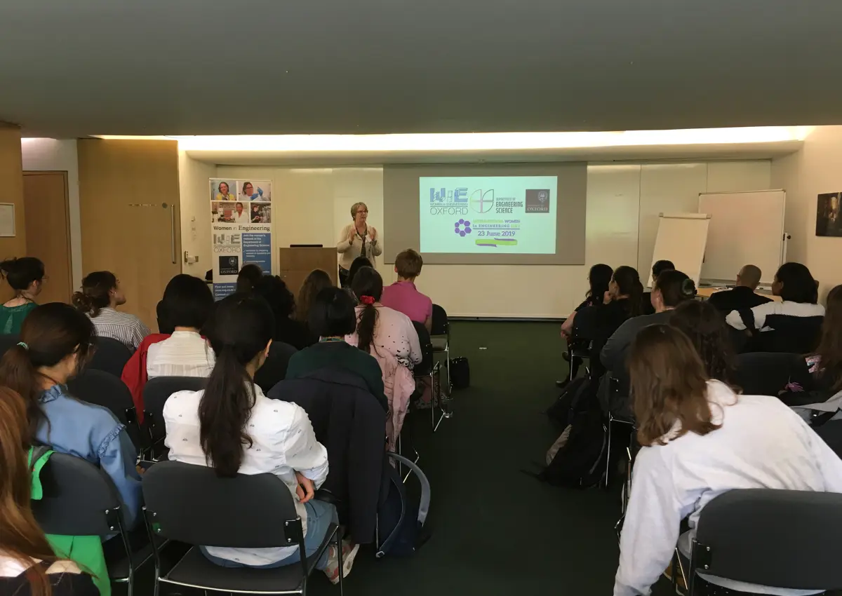 Female engineer giving a talk on International Women in Engineering Day 2019 to a room full of young students