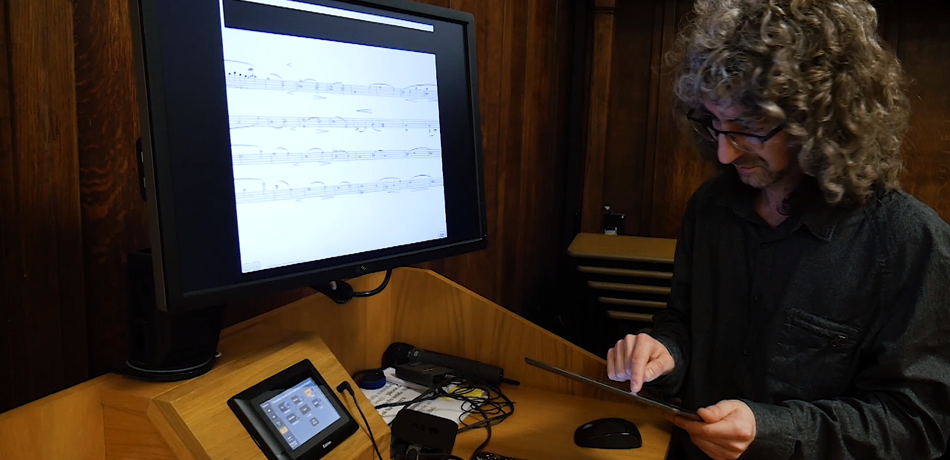 David Lewis setting up the string quartet live rehearsal annotation app for Digital Delius