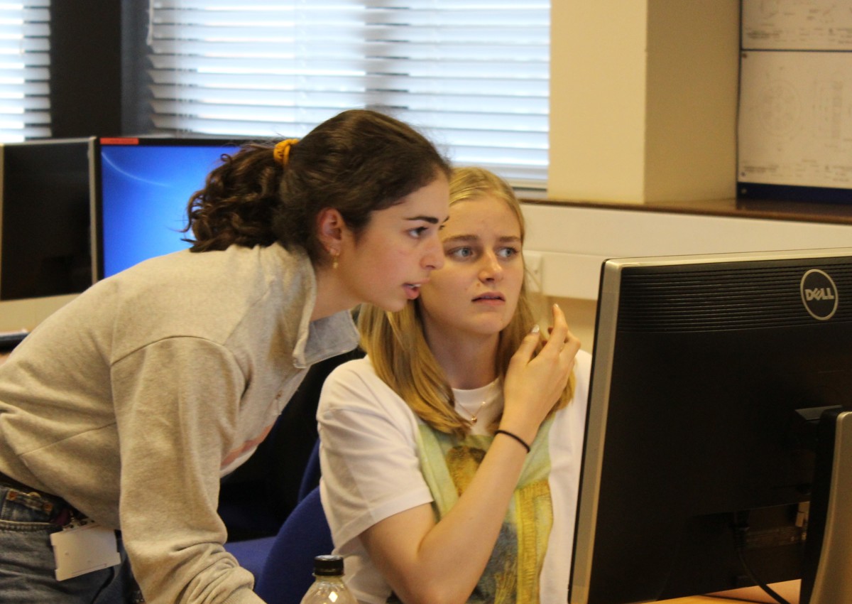 two students looking at a computer