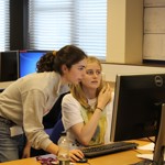 two students looking at a computer