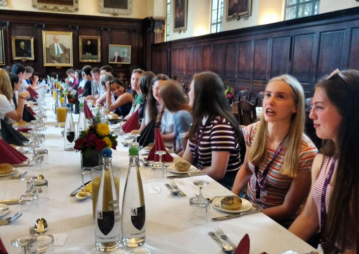 Big group of students at long dining table