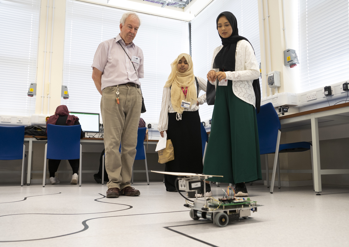 Participant of the UNIQ Summer School 2019 taking part in robotics line-following workshop, image by William Parry, Wadham College
