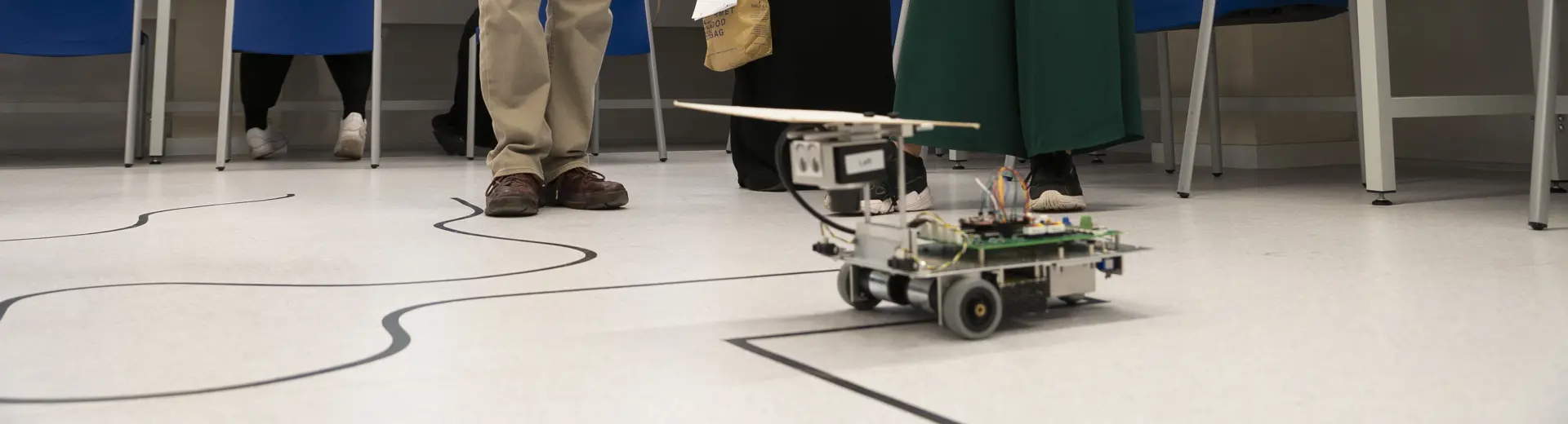 Participant of the UNIQ Summer School 2019 taking part in robotics line-following workshop, image by William Parry, Wadham College