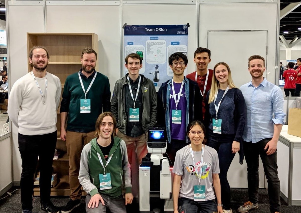 The ORIon team with their robot at the end of the 2019 Robocup competition