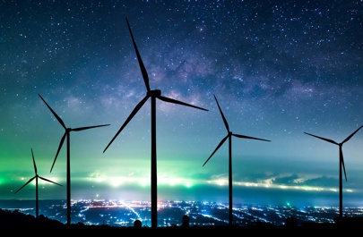 Wind turbines silhouette at night