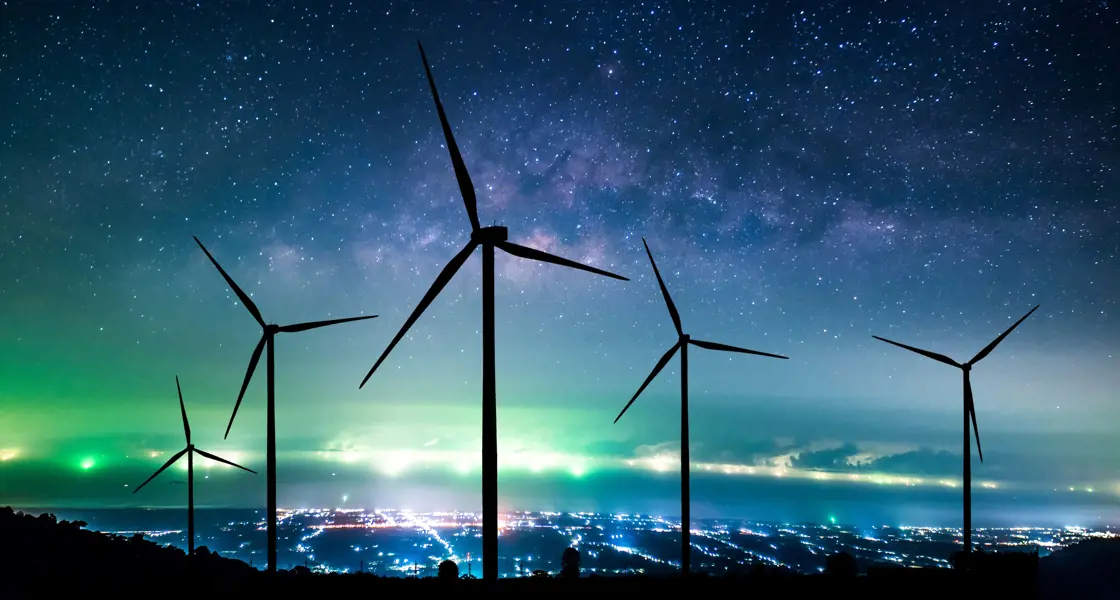 Wind turbines silhouette at night