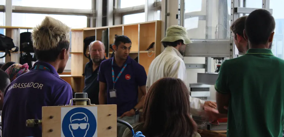 Demonstration of equipment in lab to school students during outreach programme